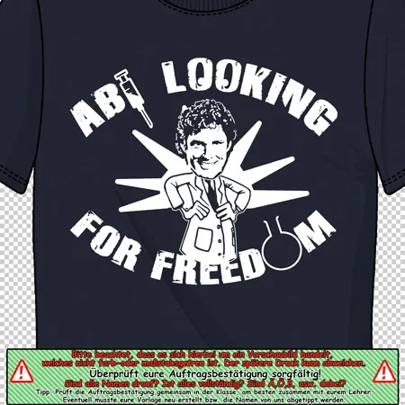 Schwarzes T-Shirt mit einem weißen Aufdruck, der eine lächelnde Person und den Text "LOOKING FOR FREEDOM" zeigt.